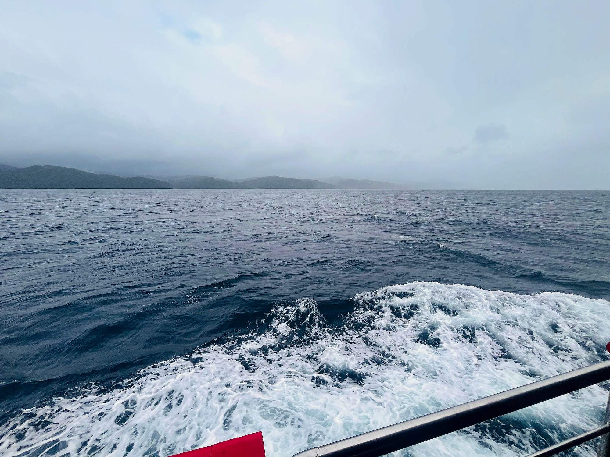 The wake of a ferry cutting across the open sea in the Andaman Islands